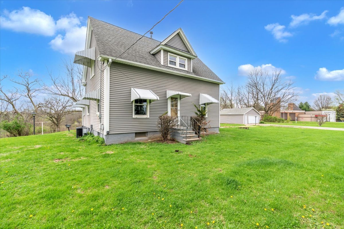 8850 Ridgewood Road Rock Island, IL 61201 - Photo 2 of 45 a view of a backyard with a garden and plants