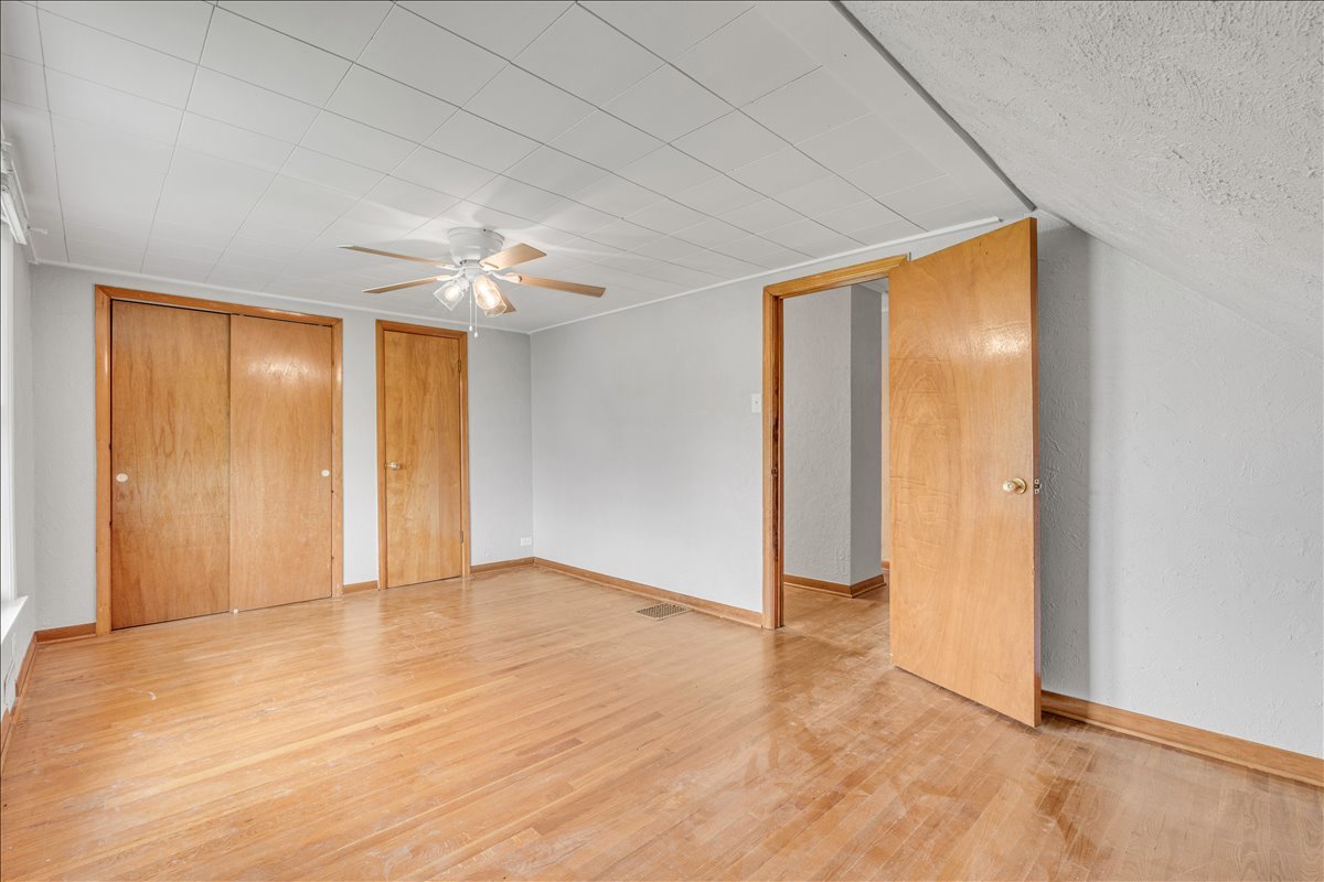 8850 Ridgewood Road Rock Island, IL 61201 - Photo 27 of 45 wooden floor in an empty room with a window