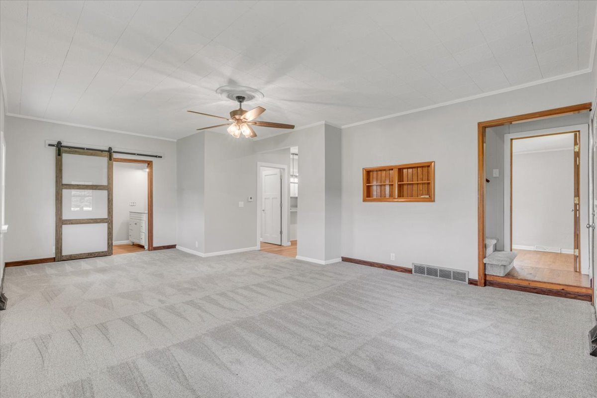 8850 Ridgewood Road Rock Island, IL 61201 - Photo 6 of 45 a view of an empty room with a window