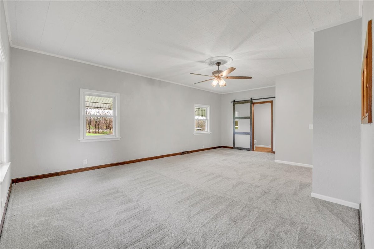 8850 Ridgewood Road Rock Island, IL 61201 - Photo 7 of 45 a view of an empty room with a window
