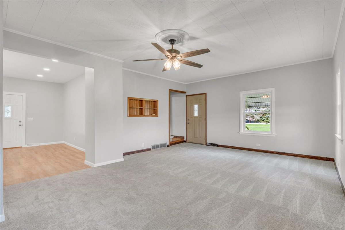 8850 Ridgewood Road Rock Island, IL 61201 - Photo 8 of 45 an empty room with fan and windows