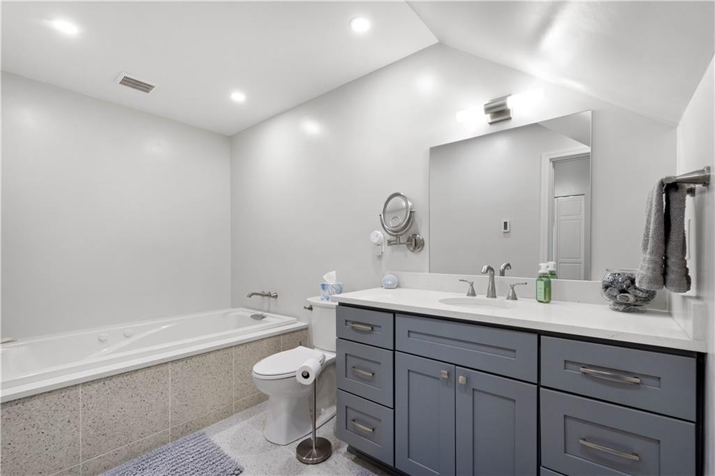 1520 4th Avenue Coraopolis, PA 15108 - Photo 19 of 37 Located on the first floor, this luxury bath features a 6 ft. air/jetted tub, extended vanity with soft close drawers, stone vanity top and tub deck.