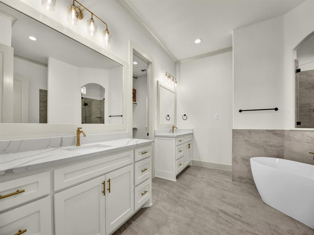 148 Daggett Drive Decatur, TX 76234 - Photo 23 of 36 a spacious bathroom with double sink and a mirror