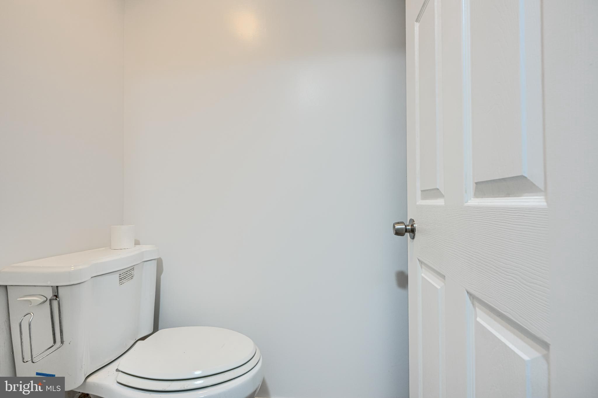 1167 Long Valley Road Westminster, MD 21158 - Photo 30 of 36 a white toilet sitting next to a white sink