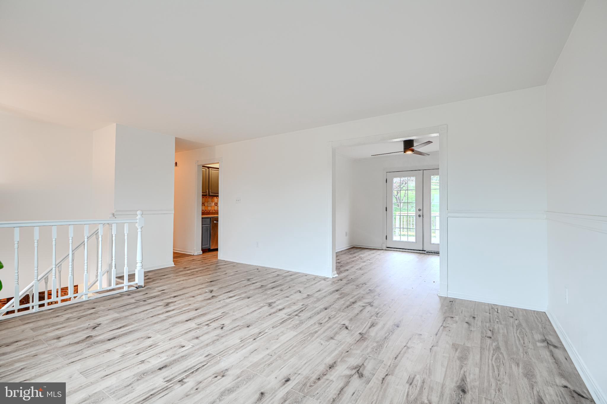 1167 Long Valley Road Westminster, MD 21158 - Photo 6 of 36 a view of an empty room with wooden floor and a window