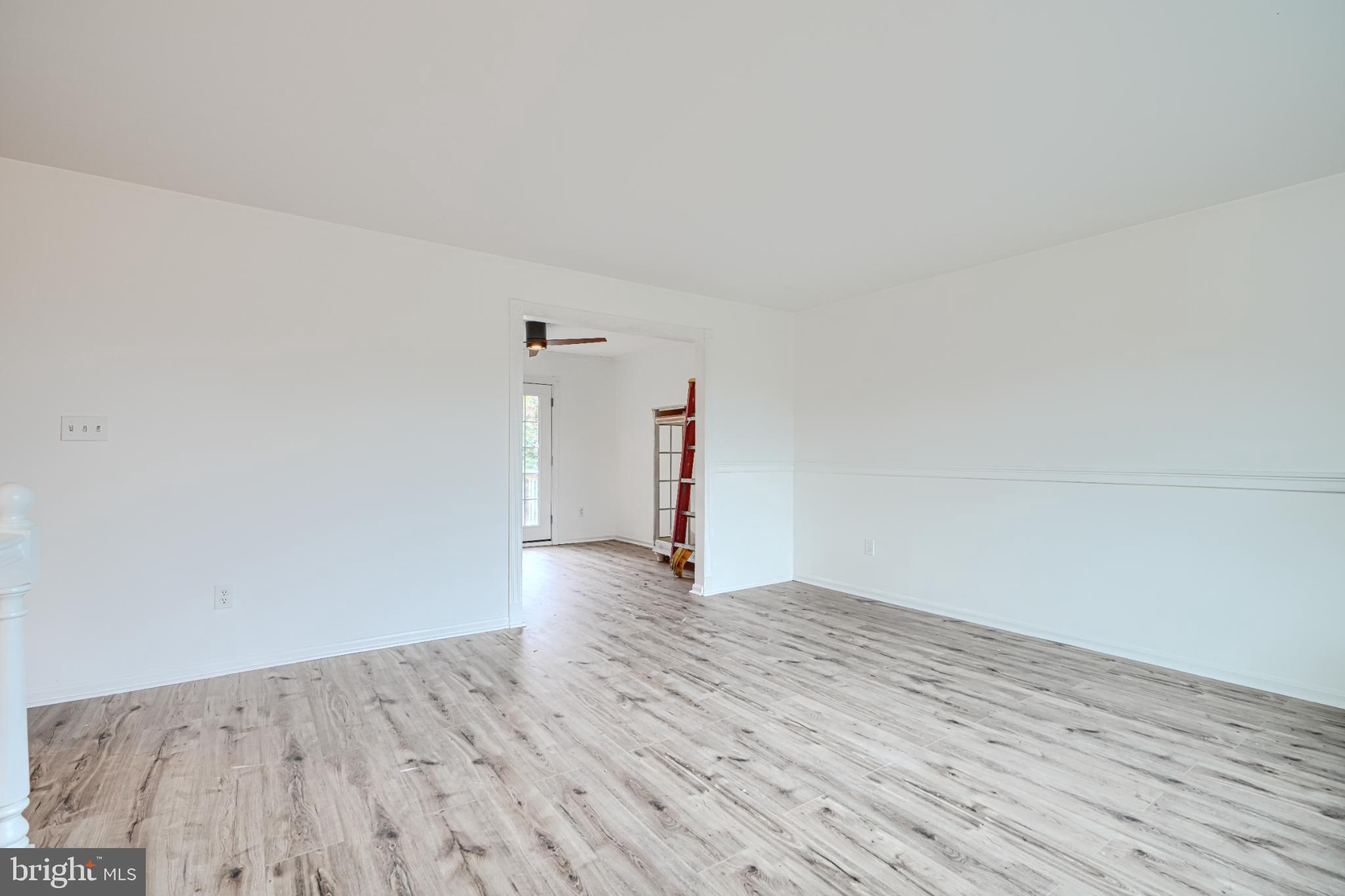 1167 Long Valley Road Westminster, MD 21158 - Photo 7 of 36 a view of empty room with wooden floor and window