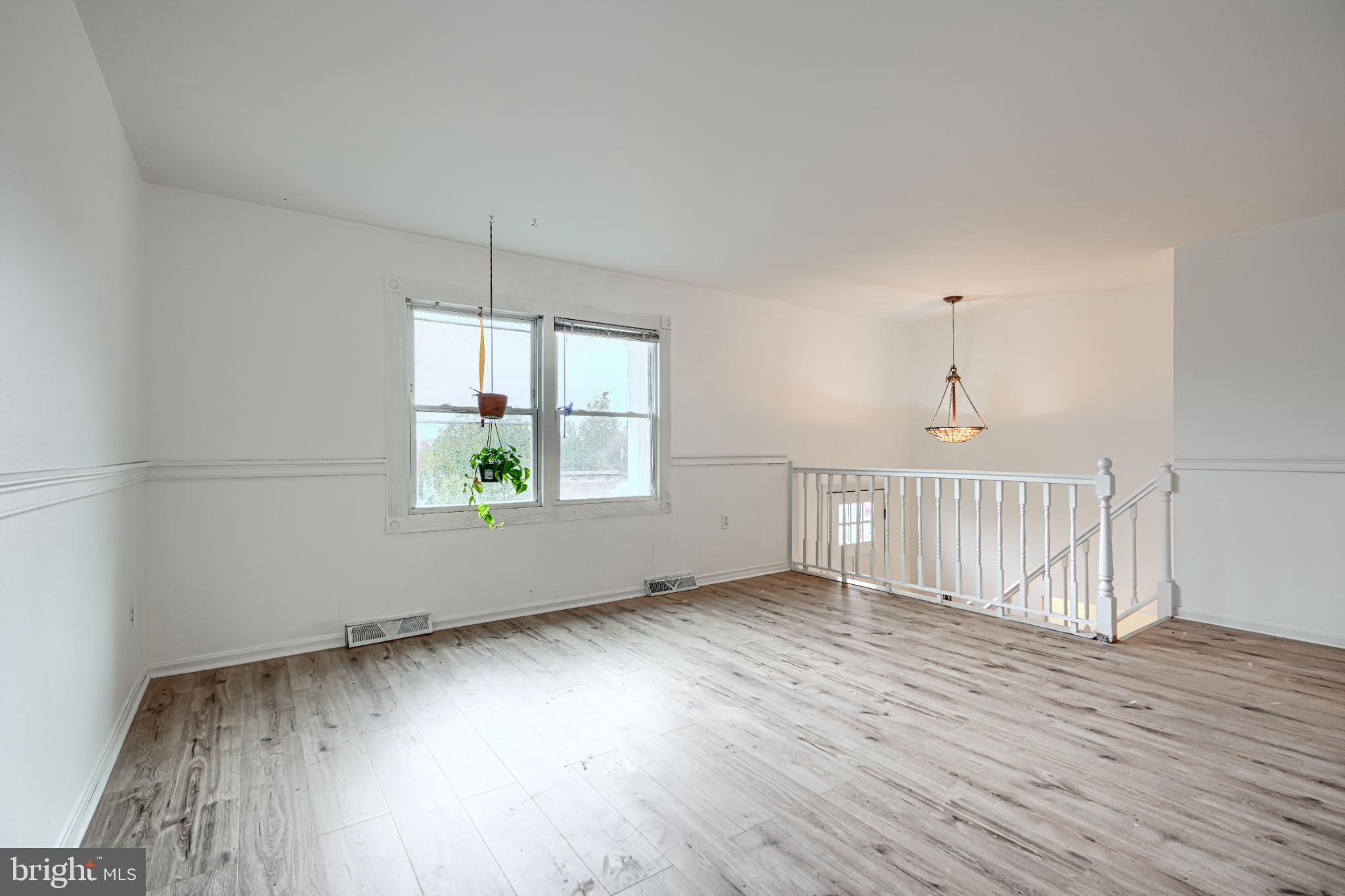 1167 Long Valley Road Westminster, MD 21158 - Photo 8 of 36 an empty room with wooden floor and windows
