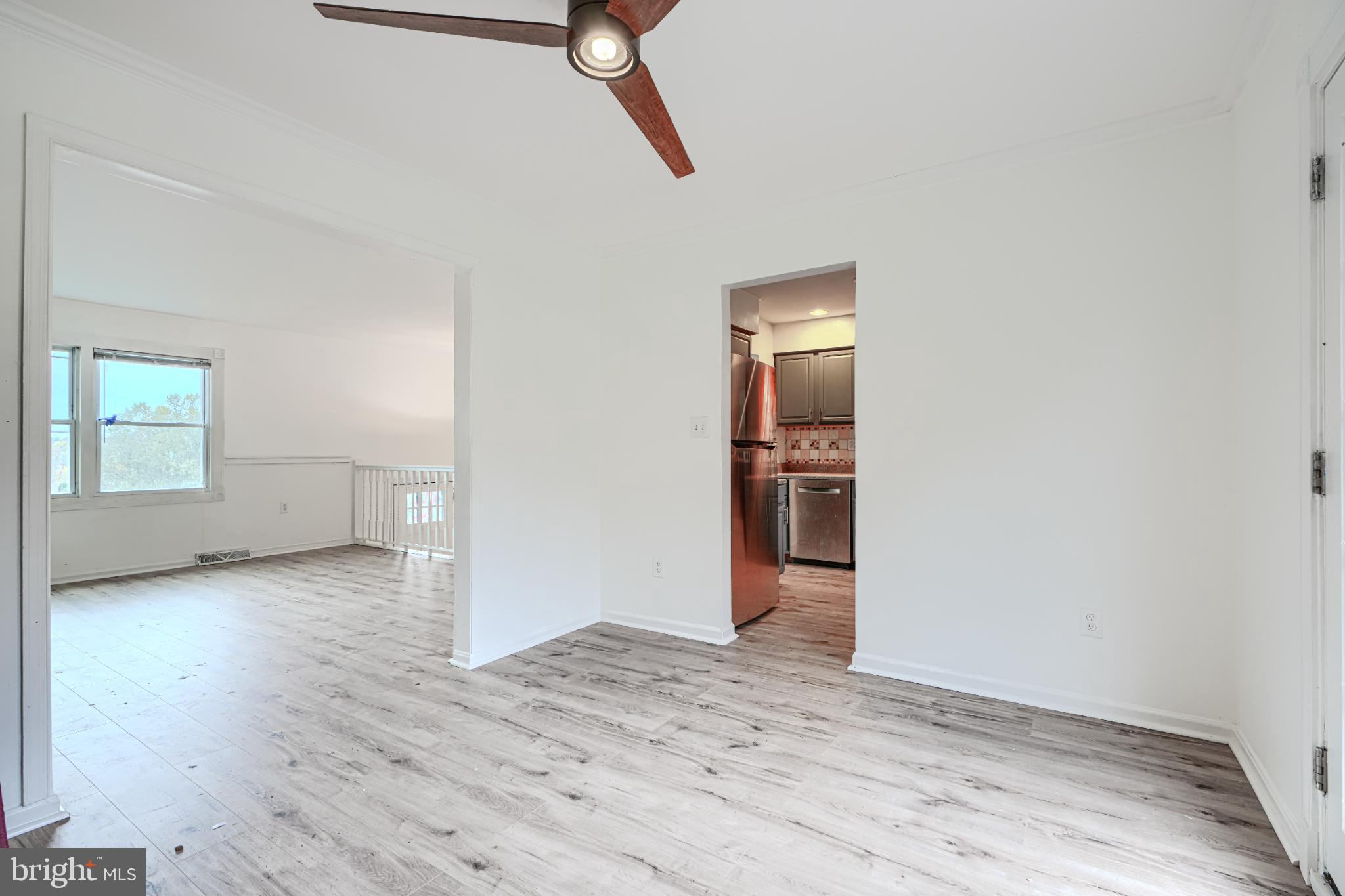 1167 Long Valley Road Westminster, MD 21158 - Photo 10 of 36 an empty room with wooden floor cabinet and windows