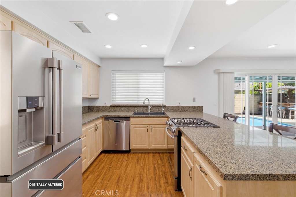 1935 West Chanticleer Road Anaheim, CA 92804 - Photo 10 of 33 Updated Kitchen with Granite Counters, upgraded Cabinets and stainless steel appliances