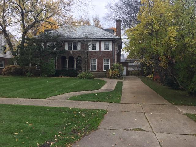 240 Raleigh Road Kenilworth, IL 60043 - Photo 10 of 10 a view of a brick building next to a yard with big trees