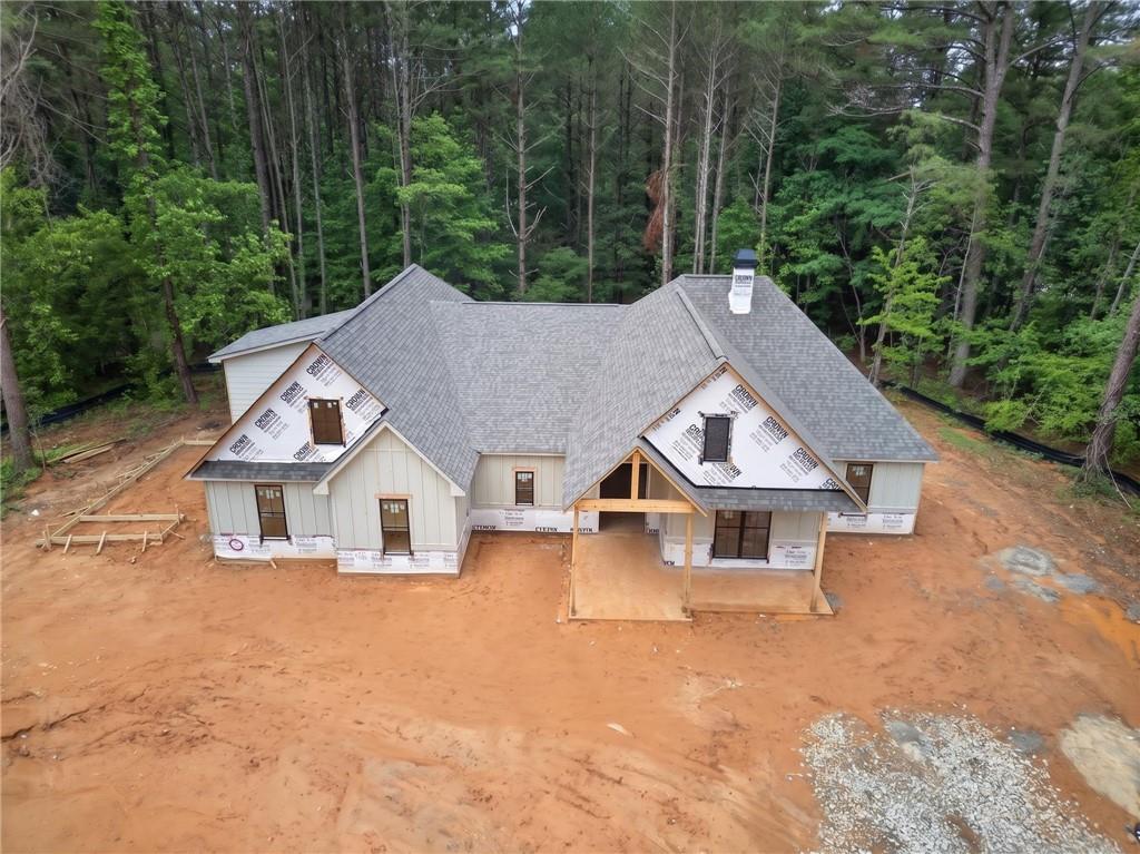 1698 Tibbitts Road Dallas, GA 30132 - Photo 5 of 16 an aerial view of house with yard and trees in the background