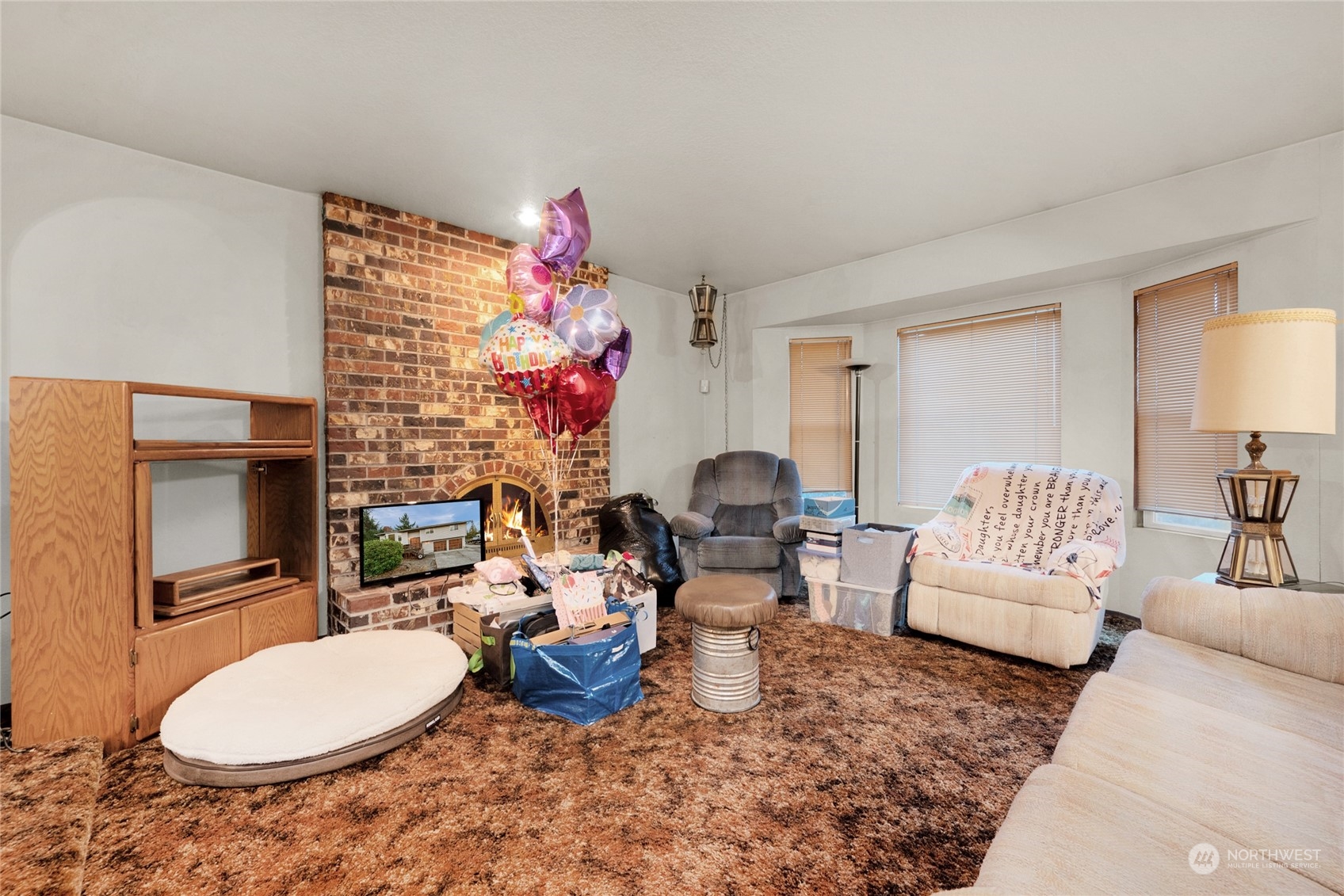 19930 13th Drive Southeast Bothell, WA 98012 - Photo 5 of 22 a living room with furniture a rug and a fireplace