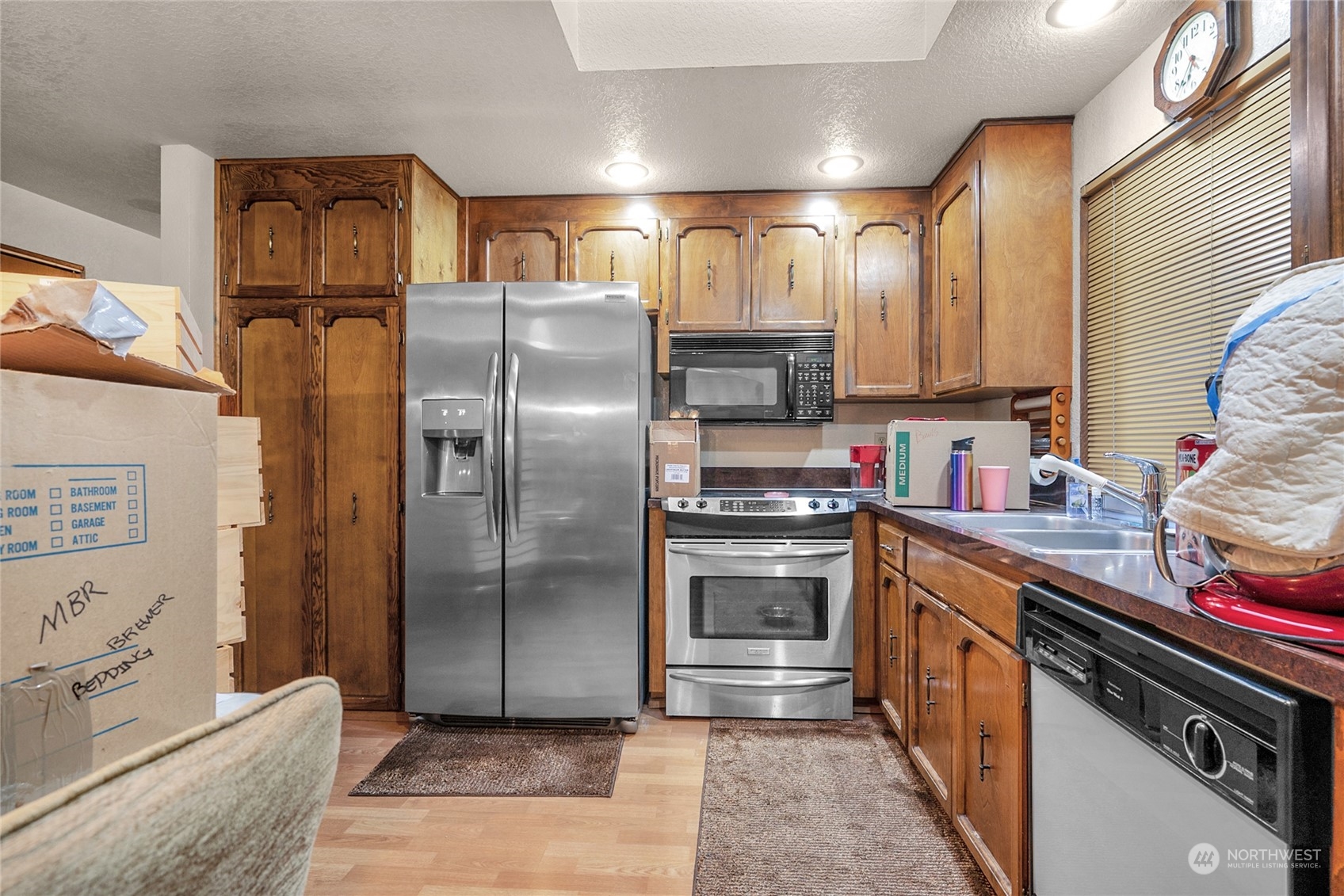 19930 13th Drive Southeast Bothell, WA 98012 - Photo 7 of 22 a kitchen with stainless steel appliances granite countertop a refrigerator and a stove