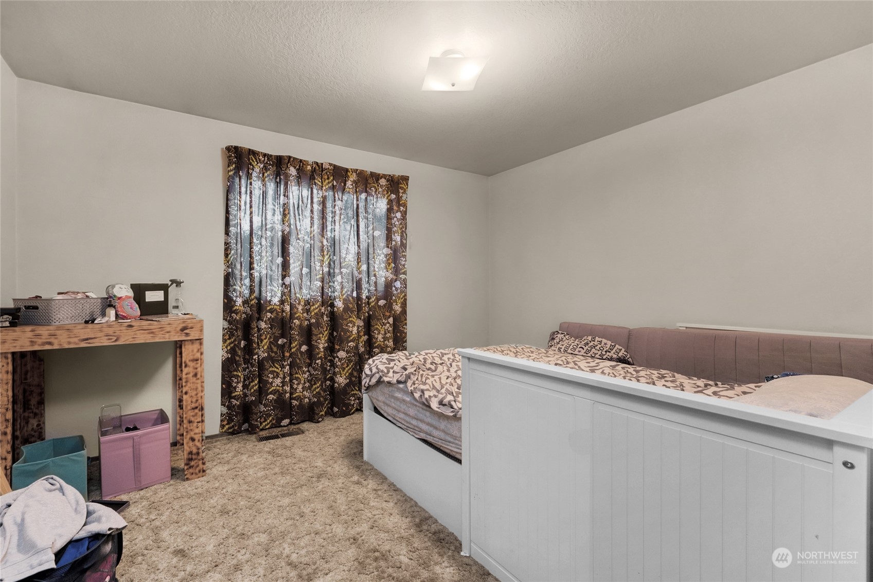 19930 13th Drive Southeast Bothell, WA 98012 - Photo 9 of 22 a bedroom with a bed and a window