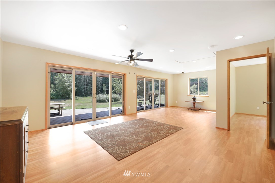 50332 Concrete Sauk Valley Road Concrete, WA 98237 - Photo 12 of 40 a view of an empty room with wooden floor and a living room
