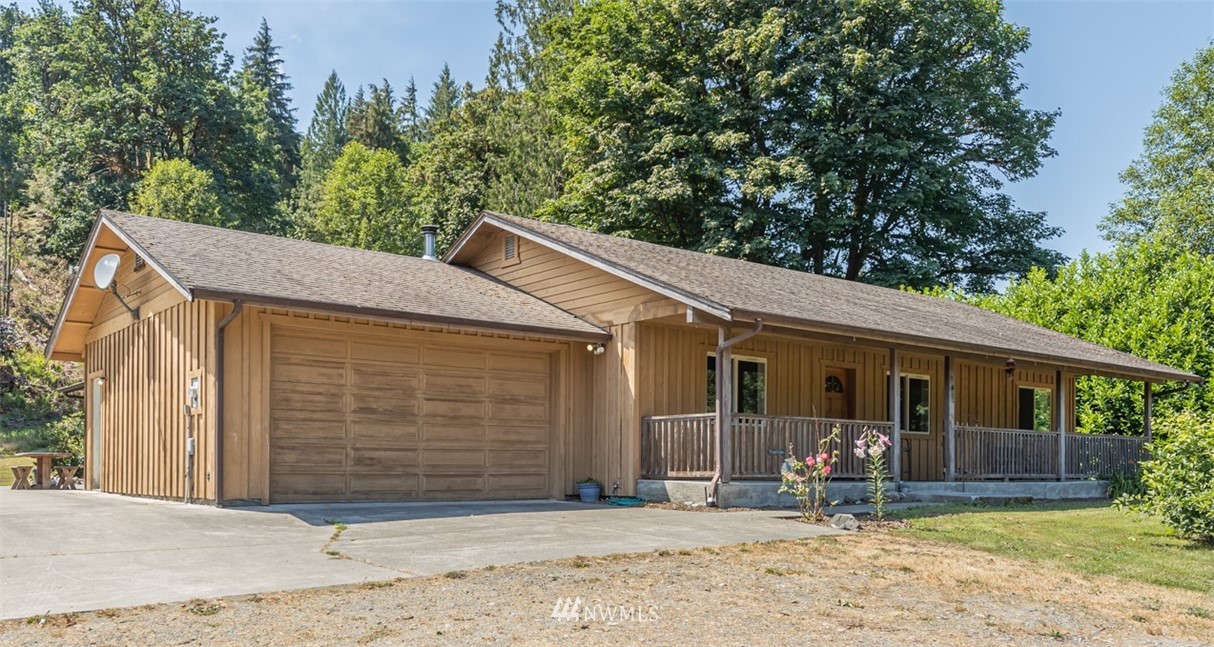 50332 Concrete Sauk Valley Road Concrete, WA 98237 - Photo 2 of 40 a front view of a house with garden