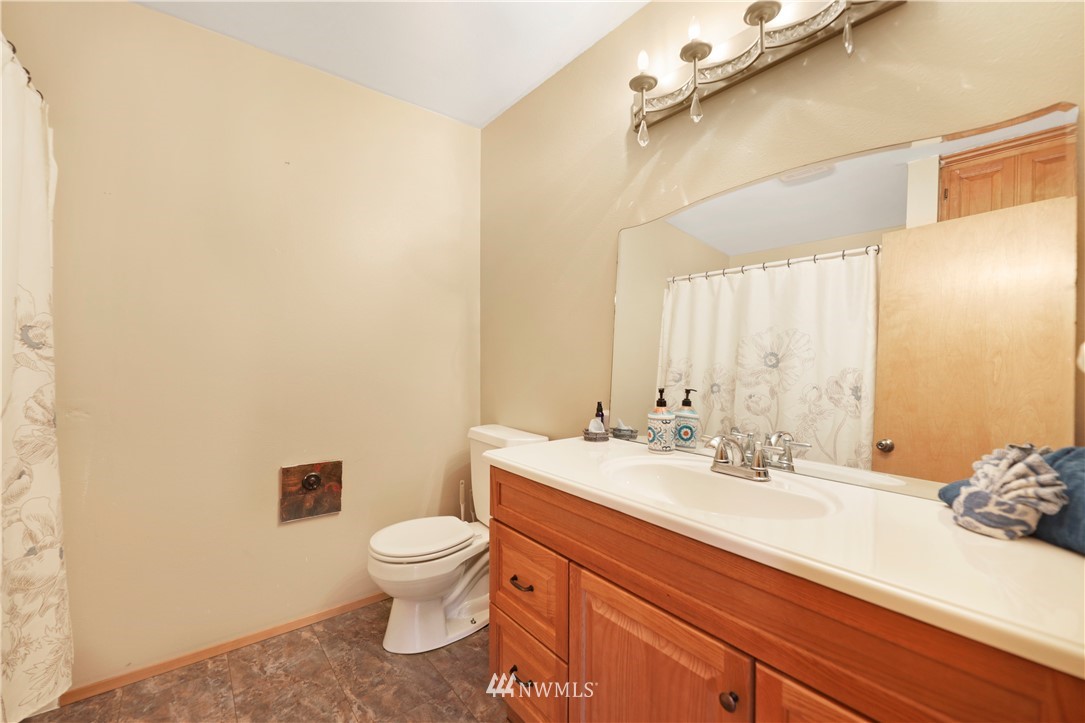 50332 Concrete Sauk Valley Road Concrete, WA 98237 - Photo 22 of 40 a bathroom with a sink a toilet and a mirror