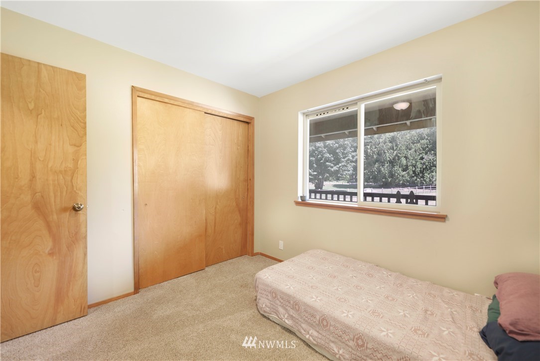50332 Concrete Sauk Valley Road Concrete, WA 98237 - Photo 23 of 40 a bedroom with a bed and a window
