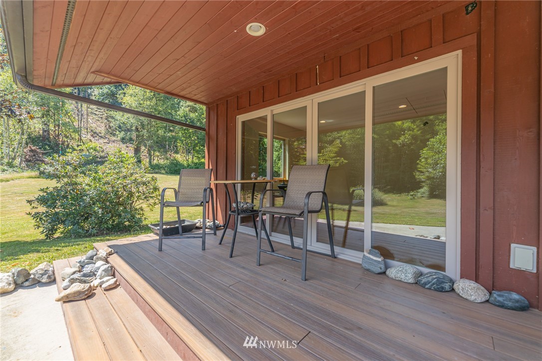 50332 Concrete Sauk Valley Road Concrete, WA 98237 - Photo 26 of 40 a view of a deck with wooden floor and outdoor seating