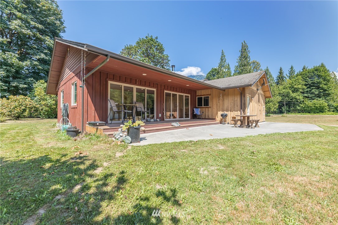50332 Concrete Sauk Valley Road Concrete, WA 98237 - Photo 28 of 40 a view of a house with backyard and sitting area