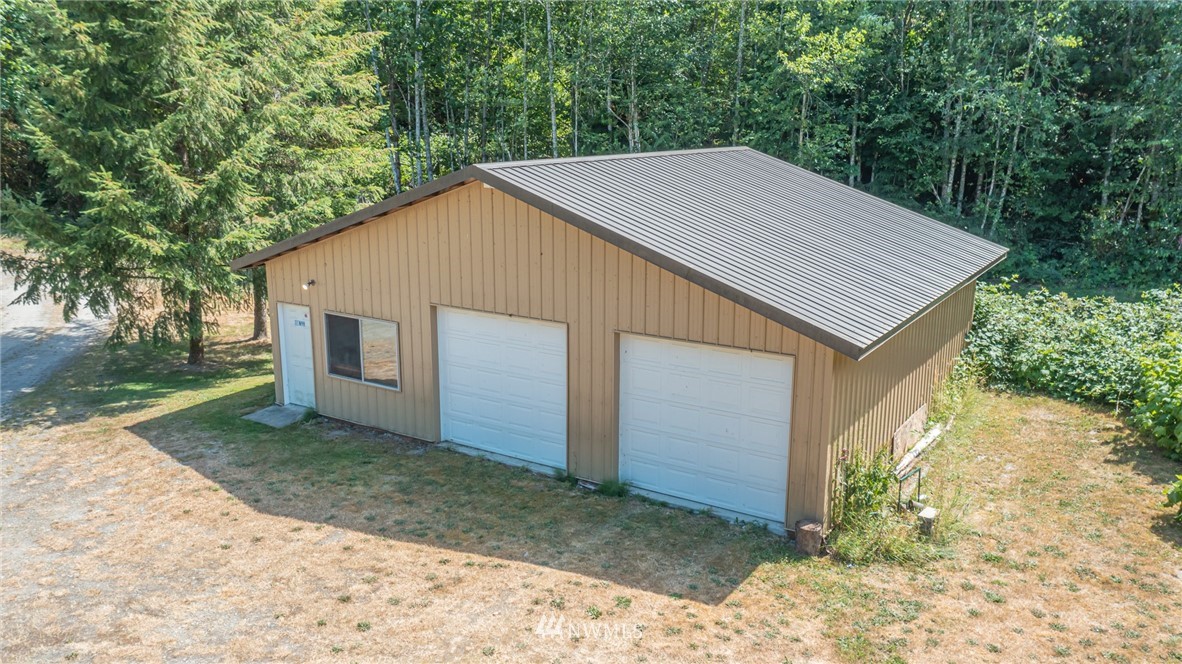 50332 Concrete Sauk Valley Road Concrete, WA 98237 - Photo 36 of 40 a view of a house with a yard and large tree