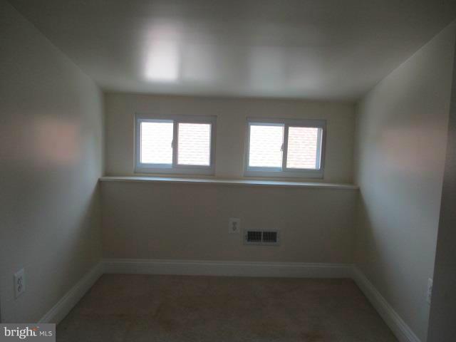 2919 Ritchie Avenue Baltimore, MD 21219 - Photo 12 of 24 an empty room that has a window