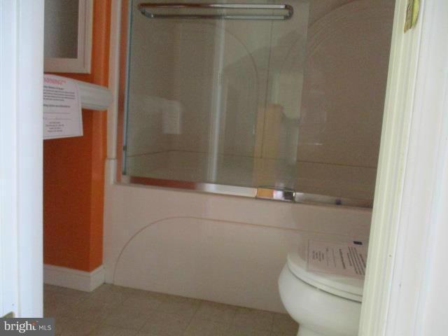 2919 Ritchie Avenue Baltimore, MD 21219 - Photo 13 of 24 a bathroom with a shower and a toilet