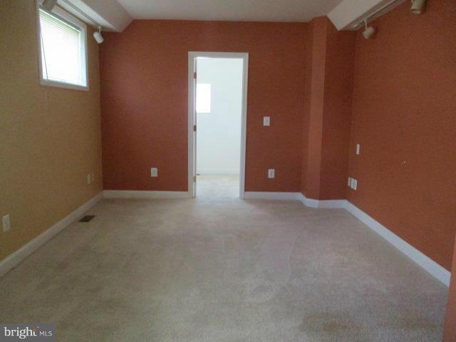 2919 Ritchie Avenue Baltimore, MD 21219 - Photo 19 of 24 an empty room with closet and windows