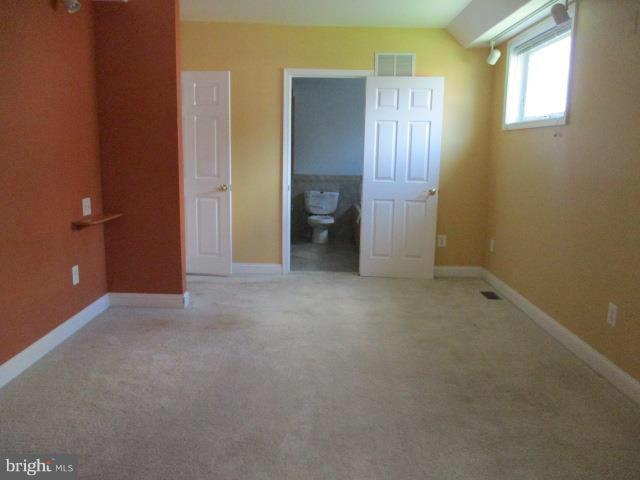 2919 Ritchie Avenue Baltimore, MD 21219 - Photo 20 of 24 an empty room with windows and closet
