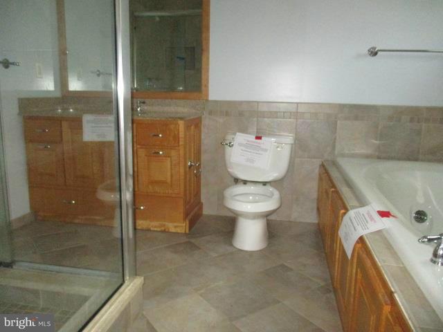 2919 Ritchie Avenue Baltimore, MD 21219 - Photo 21 of 24 a bathroom with a sink and a mirror