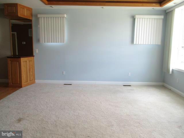 2919 Ritchie Avenue Baltimore, MD 21219 - Photo 5 of 24 an empty room with windows