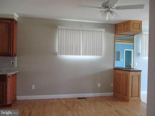 2919 Ritchie Avenue Baltimore, MD 21219 - Photo 8 of 24 a view of an empty room with a window