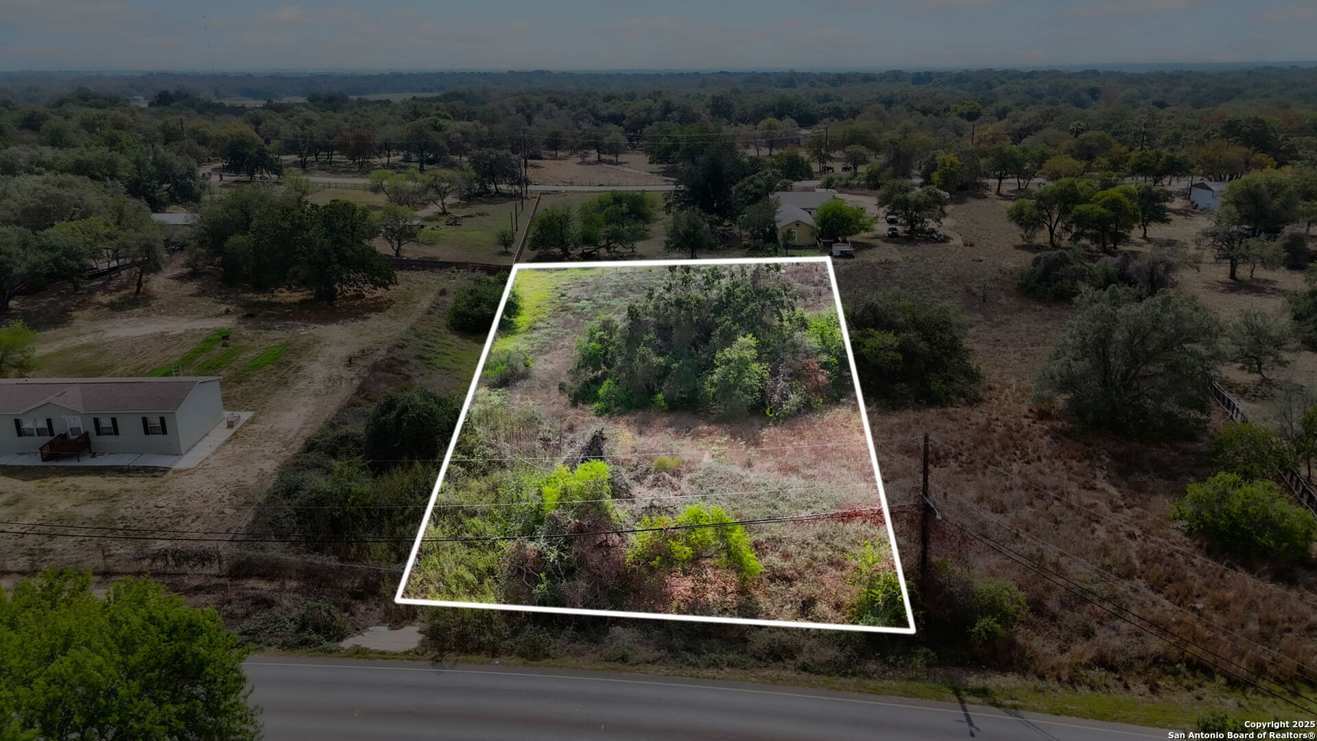 3810 New Mathis Road Elmendorf, TX 78112 - Photo 4 of 15 a view of a yard