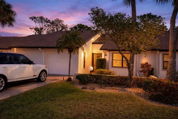 a view of a car in front of a house