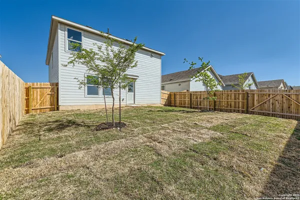 a picture of a bench in front of a building