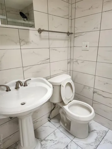 a bathroom with a toilet and a sink