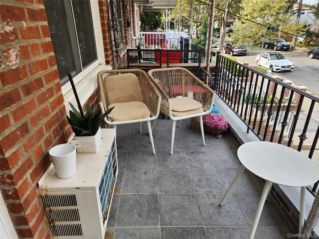 a view of a chairs and table in backyard