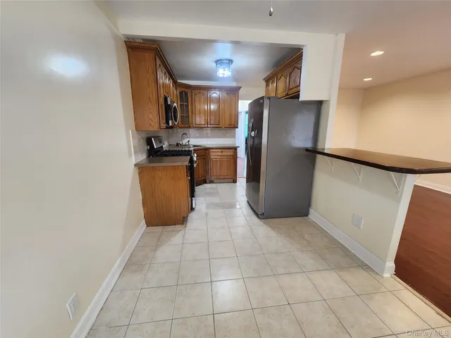 a kitchen with a refrigerator and a cabinets