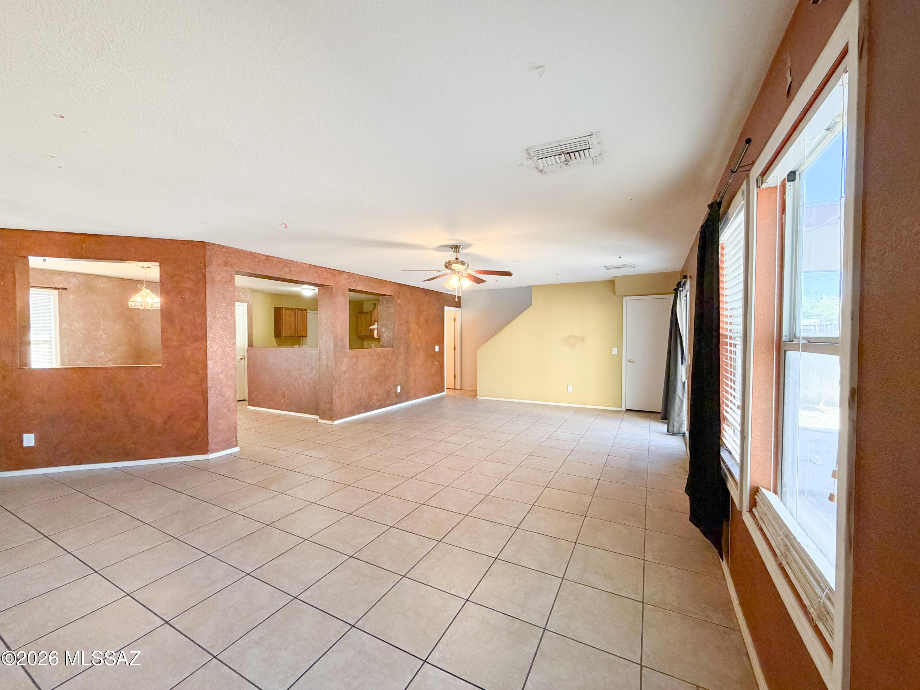 5779 South Manta Ray Road Tucson, AZ 85706 - Photo 5 of 30 a view of a livingroom with an empty space and a window