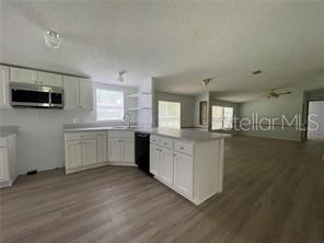 5416 Miley Road Plant City, FL 33565 - Photo 11 of 19 a kitchen with a sink and a stove top oven