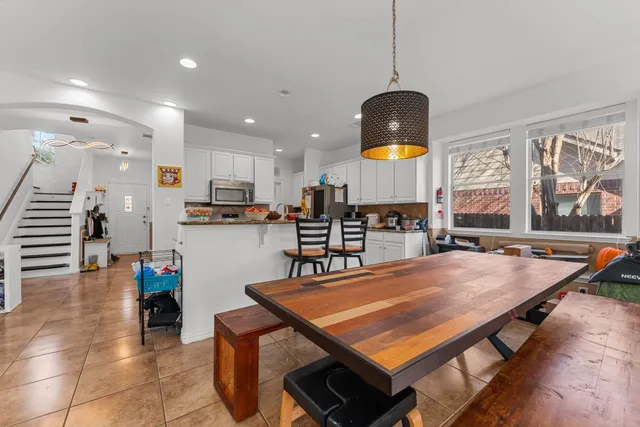a kitchen with a table and chairs in it