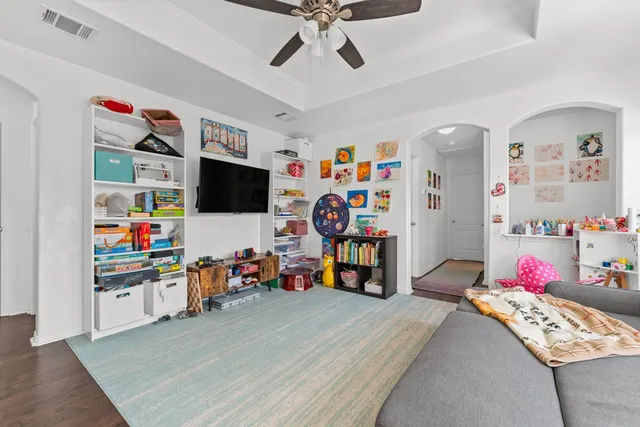 a view of a workspace with furniture and toys