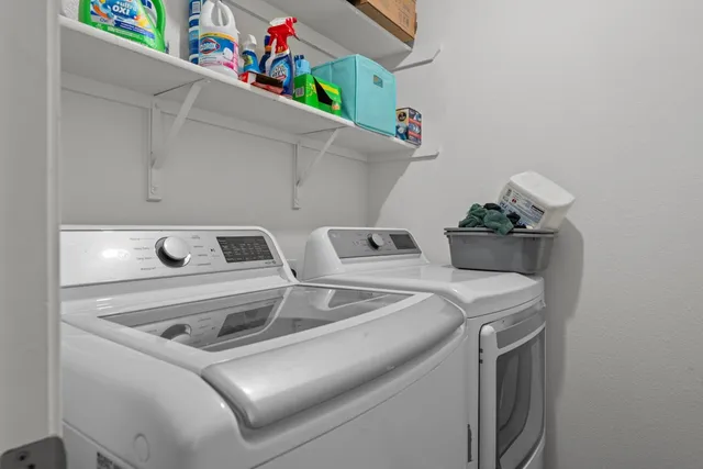 a utility room with dryer and washer