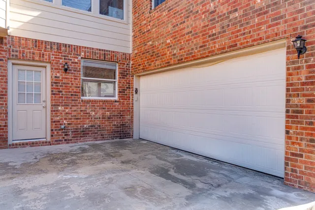 a view of a backyard with wooden fence
