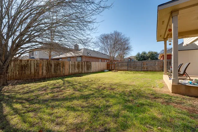 a view of a house with a yard patio and a outdoor space