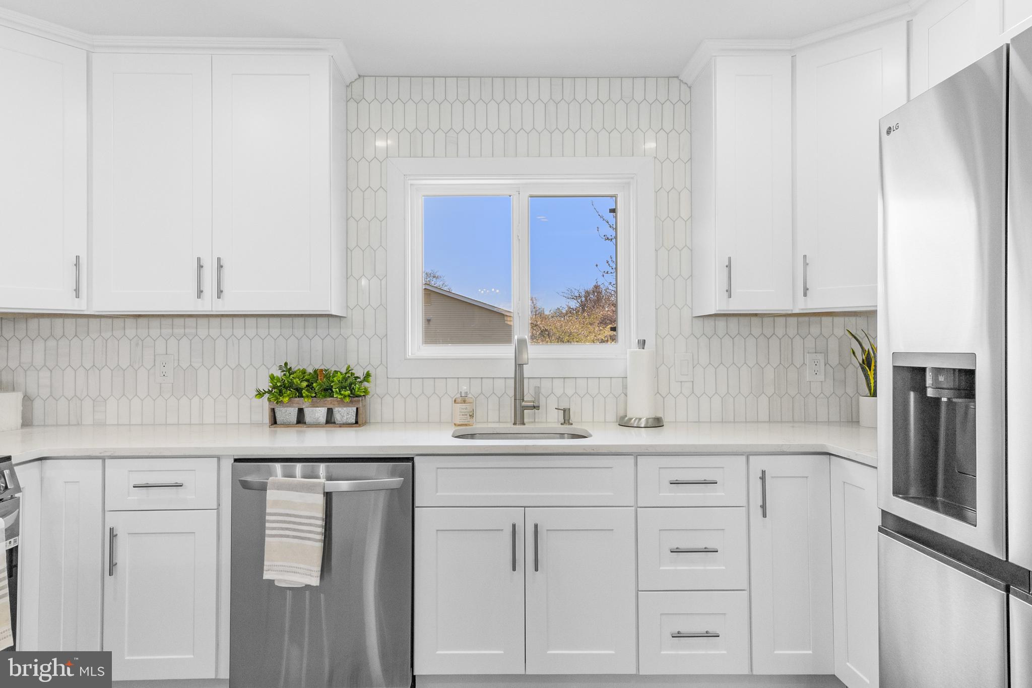 737A Prospect Road Monroe Township, NJ 08831 - Photo 11 of 28 a kitchen with stainless steel appliances white cabinets and a window