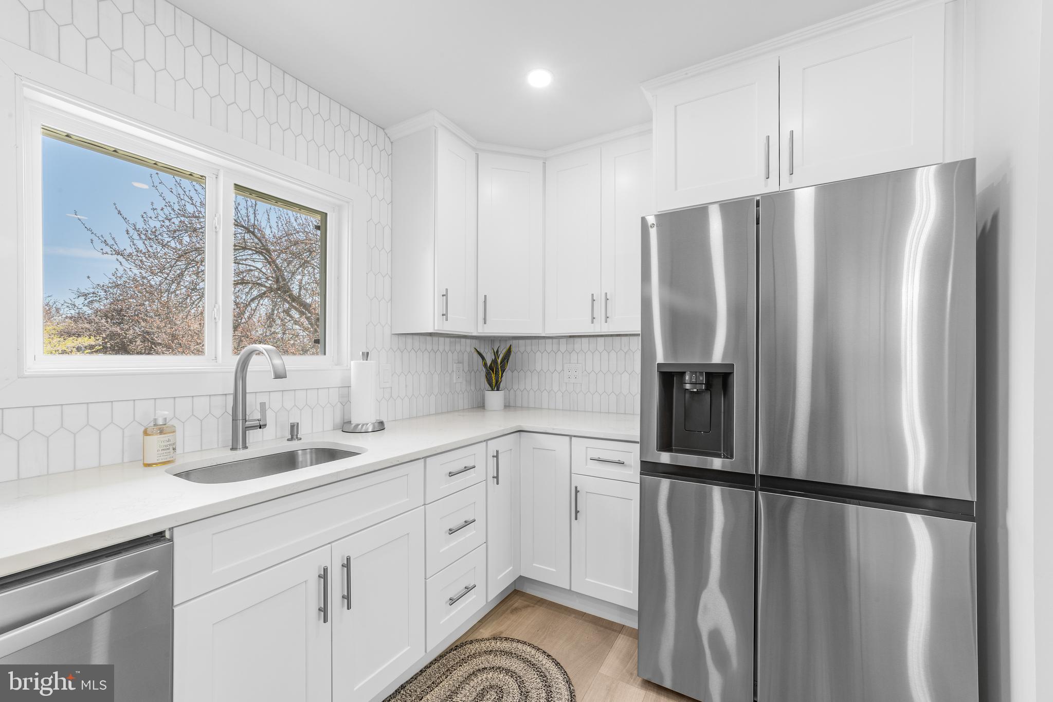 737A Prospect Road Monroe Township, NJ 08831 - Photo 13 of 28 a kitchen with a refrigerator a sink and cabinets