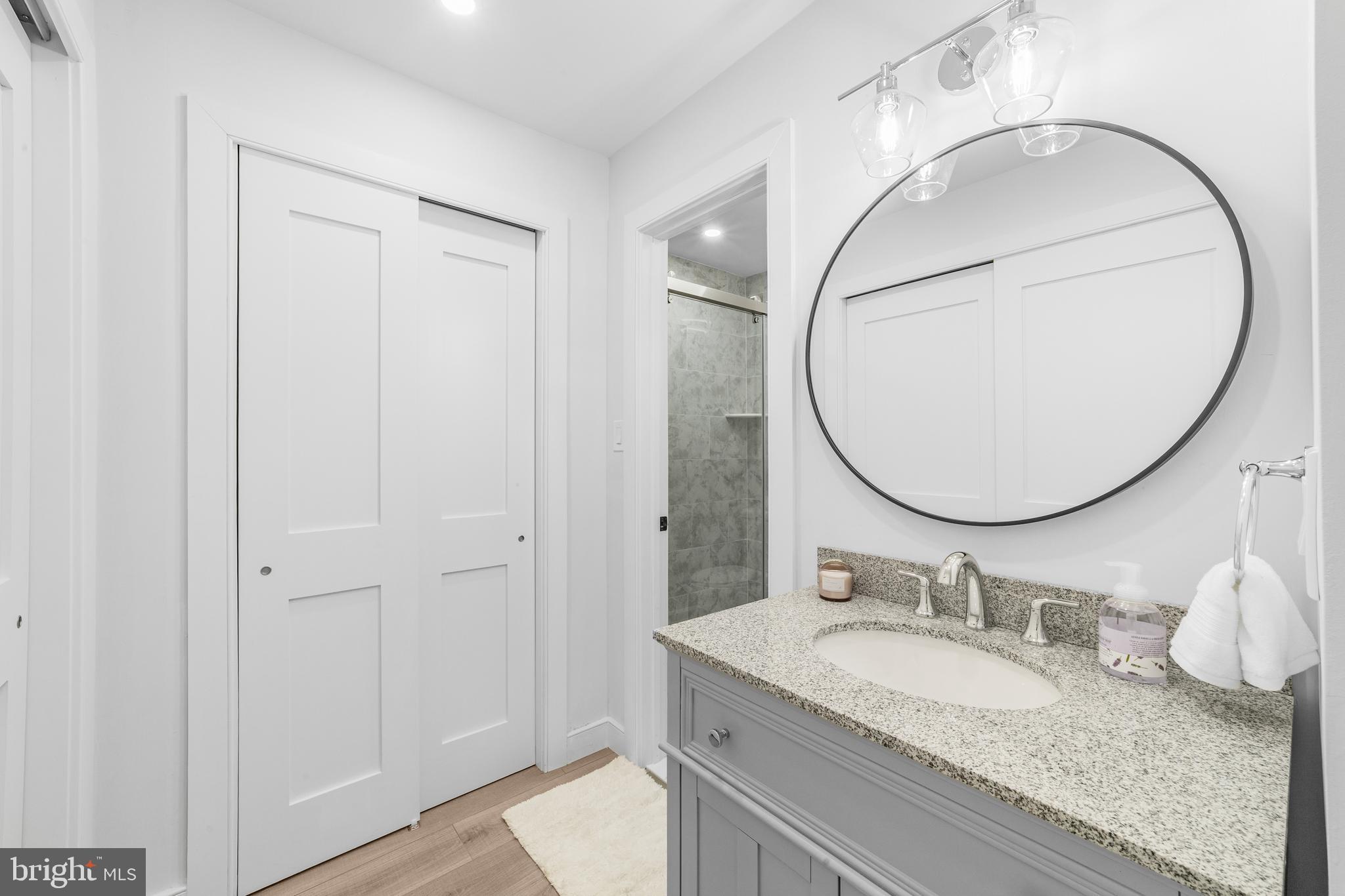 737A Prospect Road Monroe Township, NJ 08831 - Photo 17 of 28 a bathroom with a granite countertop sink mirror and vanity