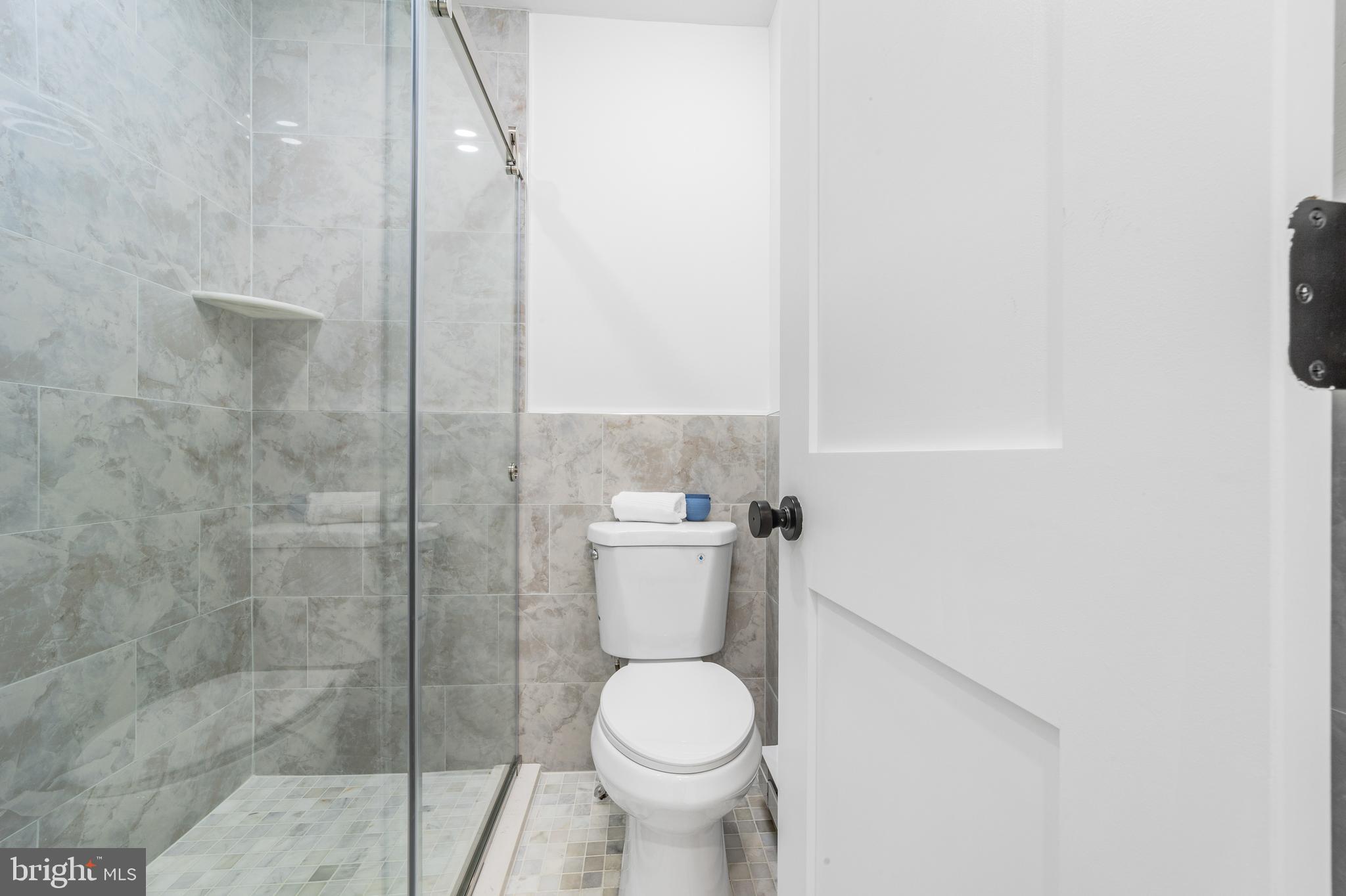 737A Prospect Road Monroe Township, NJ 08831 - Photo 18 of 28 a white toilet sitting next to a bathroom sink