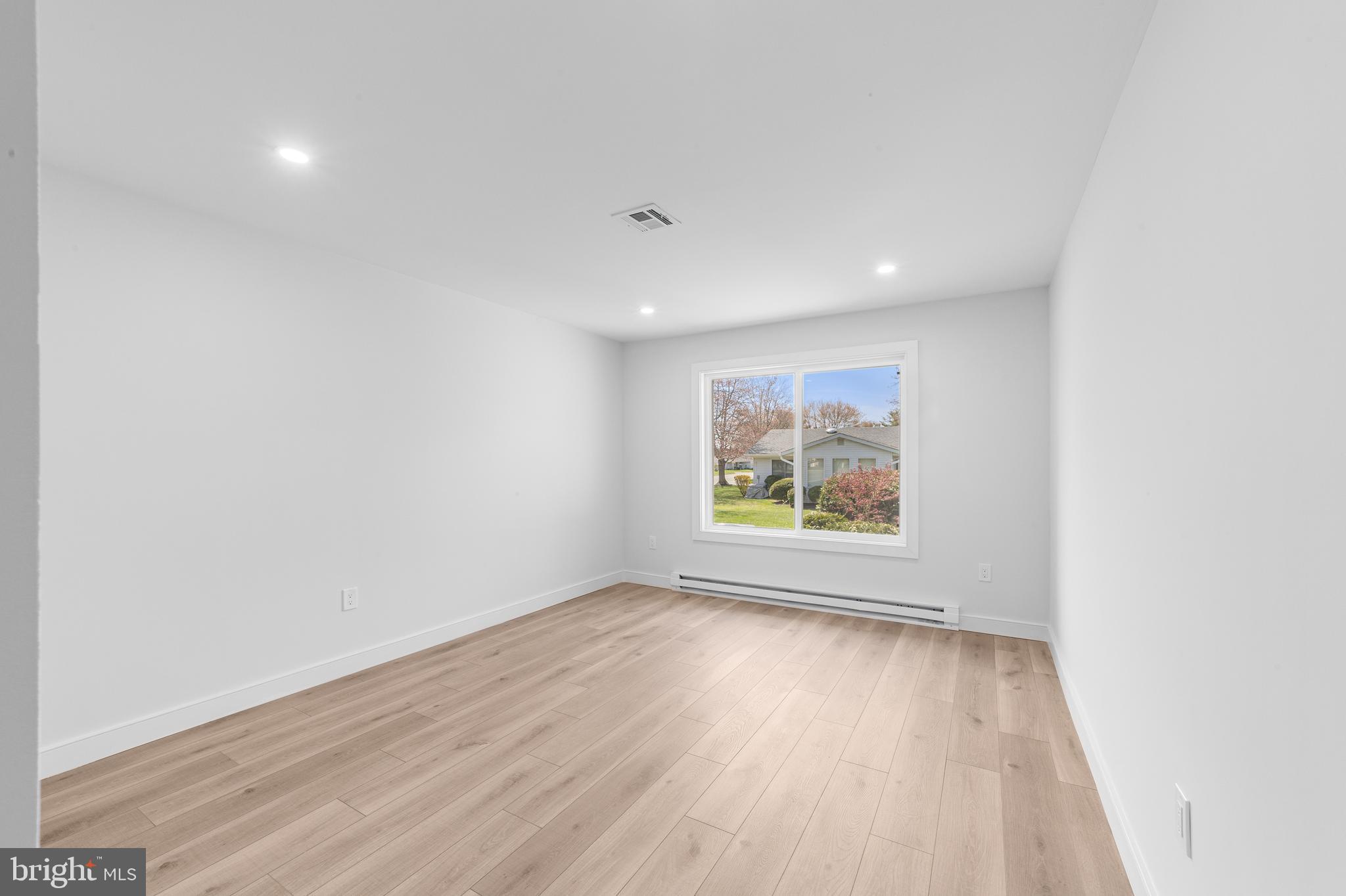 737A Prospect Road Monroe Township, NJ 08831 - Photo 19 of 28 an empty room with wooden floor and window